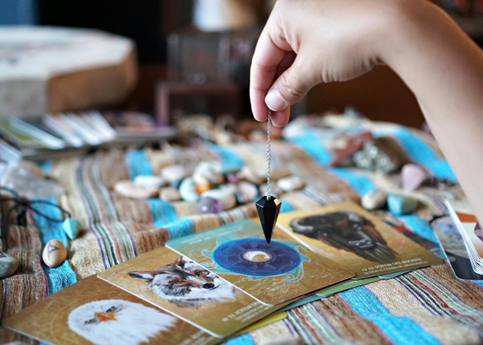 Pendulum dowsing in Pune with crystal healing and expert divination for personalised spiritual guidance